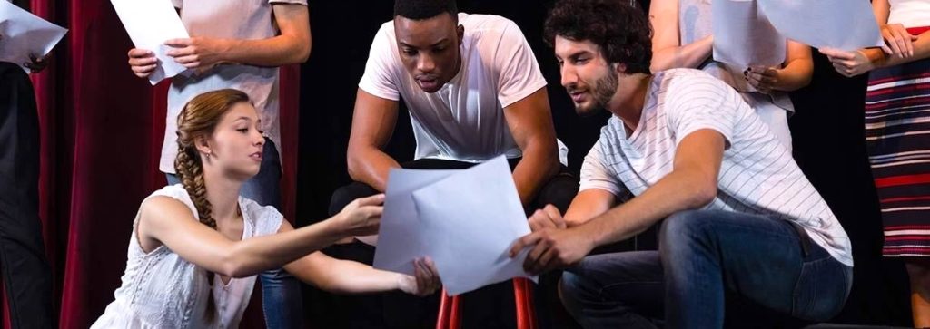 young actors reviewing scripts